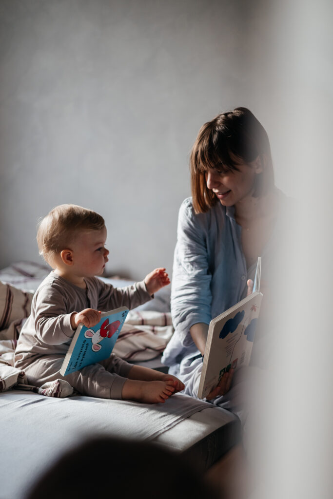 02032022-vinnitsa-ukraine-young-mother-little-daughter-woke-up-bed-having-fun-hugging-looking-book