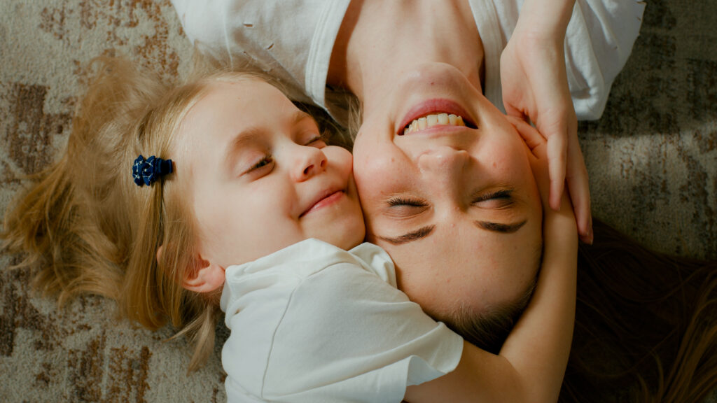 cute-affectionate-adopted-little-kid-preschool-girl-hugging-cuddling-mother-head-top-view-child
