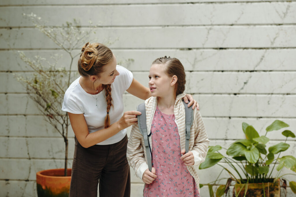 mom-getting-her-daughter-ready-school