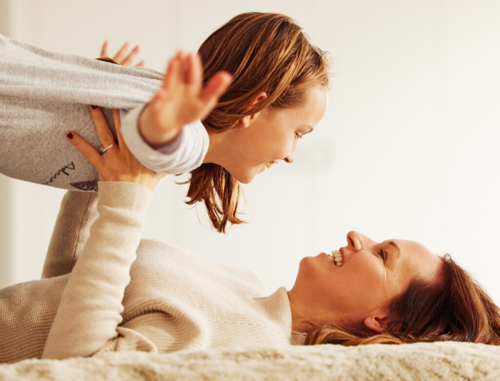 mom-girl-happy-with-plane-bed-with-smile-care-bonding-with-games-morning-family-home-airplane-mother-daughter-with-playful-connection-child-relax-with-love-apartment